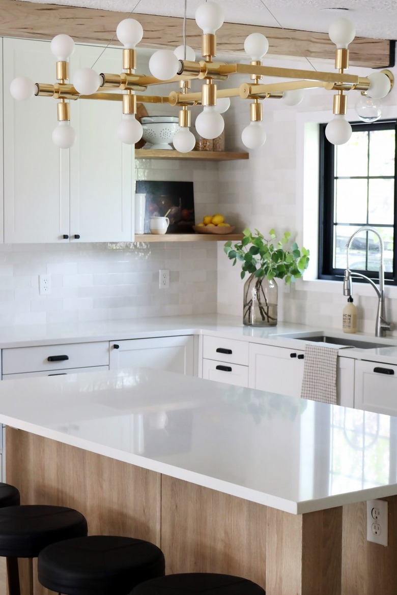 traditional kitchen with modern brass chandelier