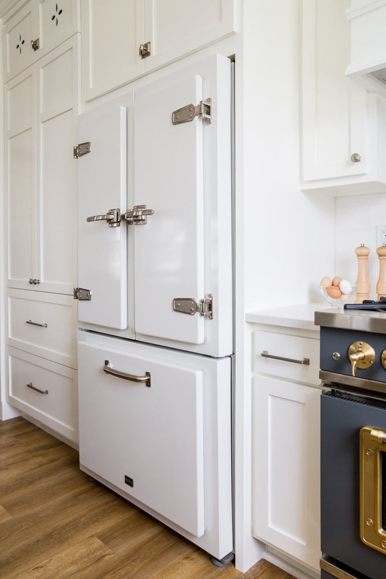 vintage refrigerator in traditional white kitchen