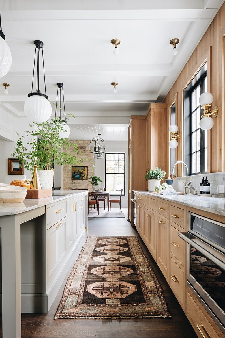 traditional kitchen with wood cabinets and marble countertops