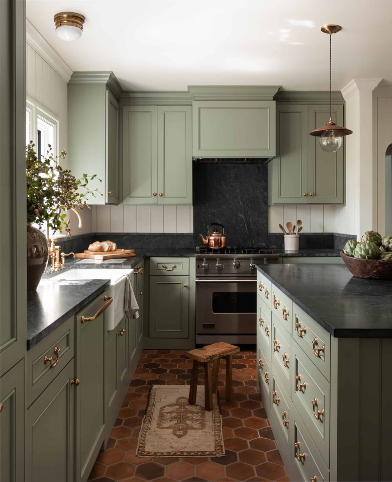 Green and traditional kitchen island in green kitchen