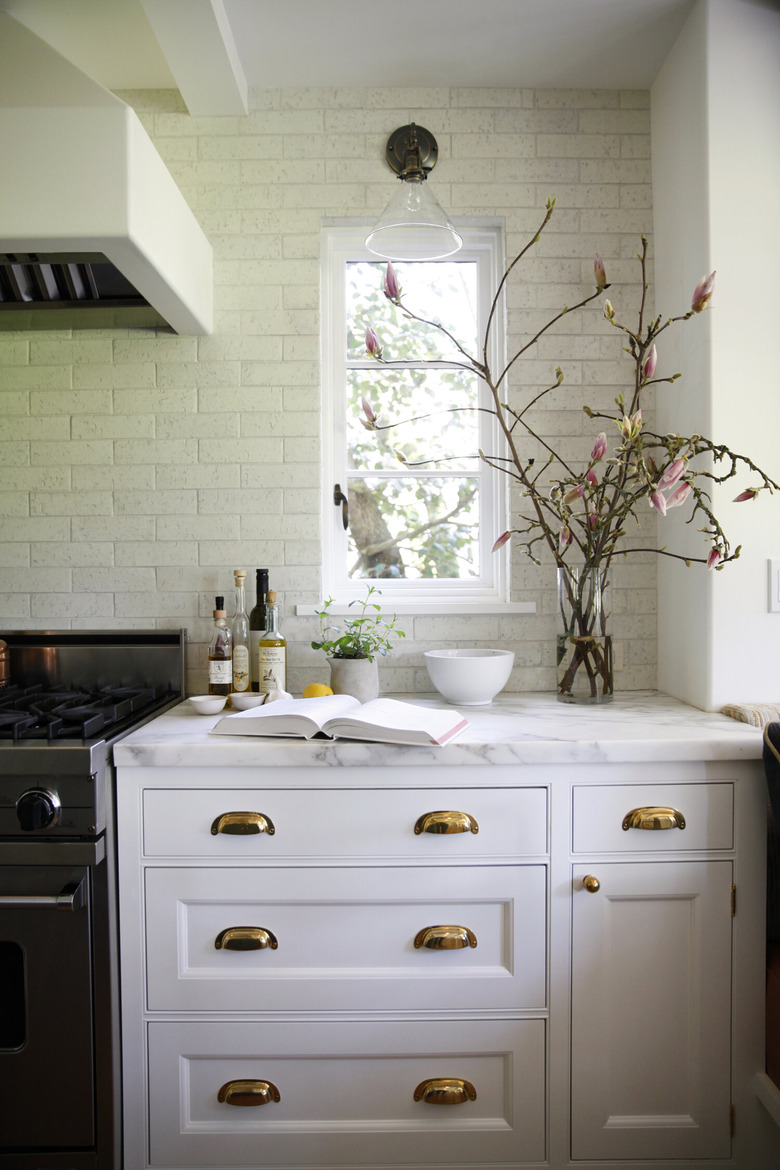 traditional kitchen lighting with sconce near window