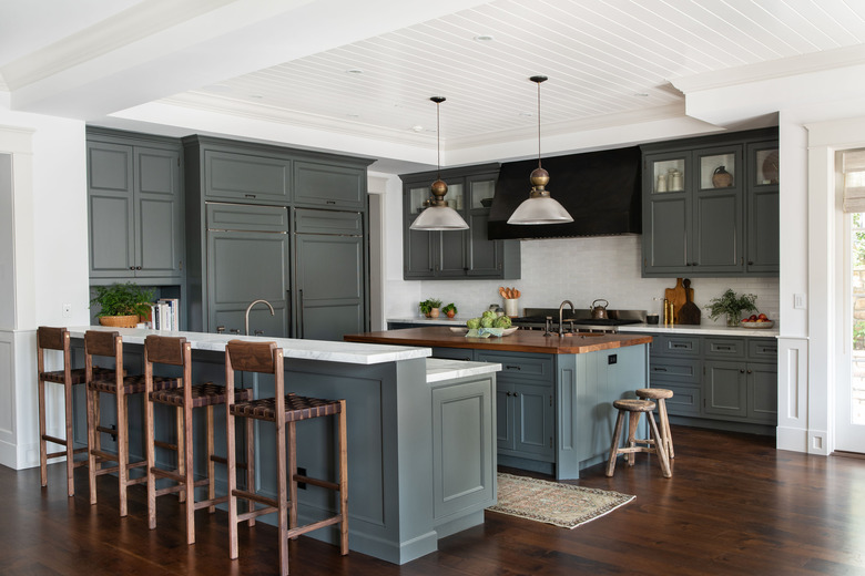 traditional kitchen lighting with green cabinets