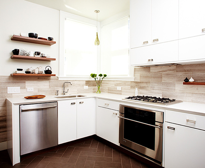 modern kitchen with oversized travertine backsplash