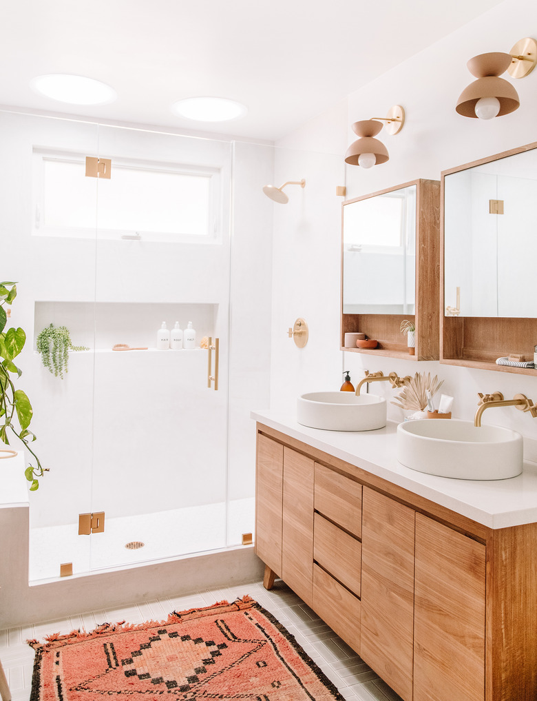 terra cotta and brown bathroom color with wooden vanity and colorful area rug