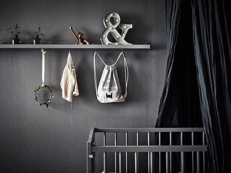 nursery idea for 2020 with dark color palette and ceiling canopy