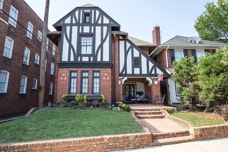 traditional tudor home with brown and white