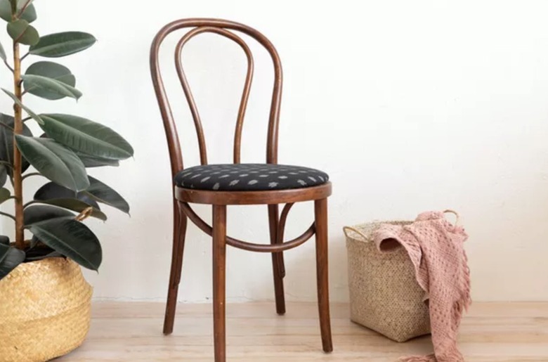 Dining chair, basket, blanket.