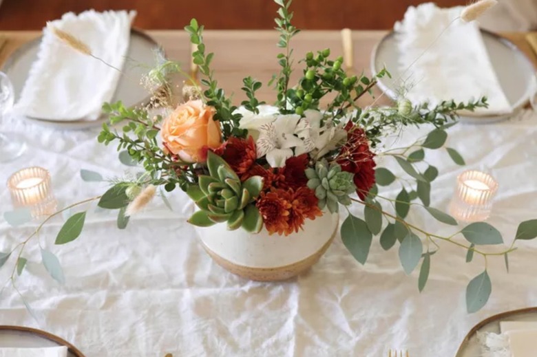 Succulent and floral centerpiece, candles.