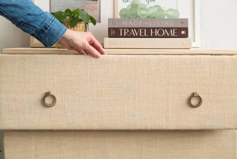 Dresser covered in burlap.