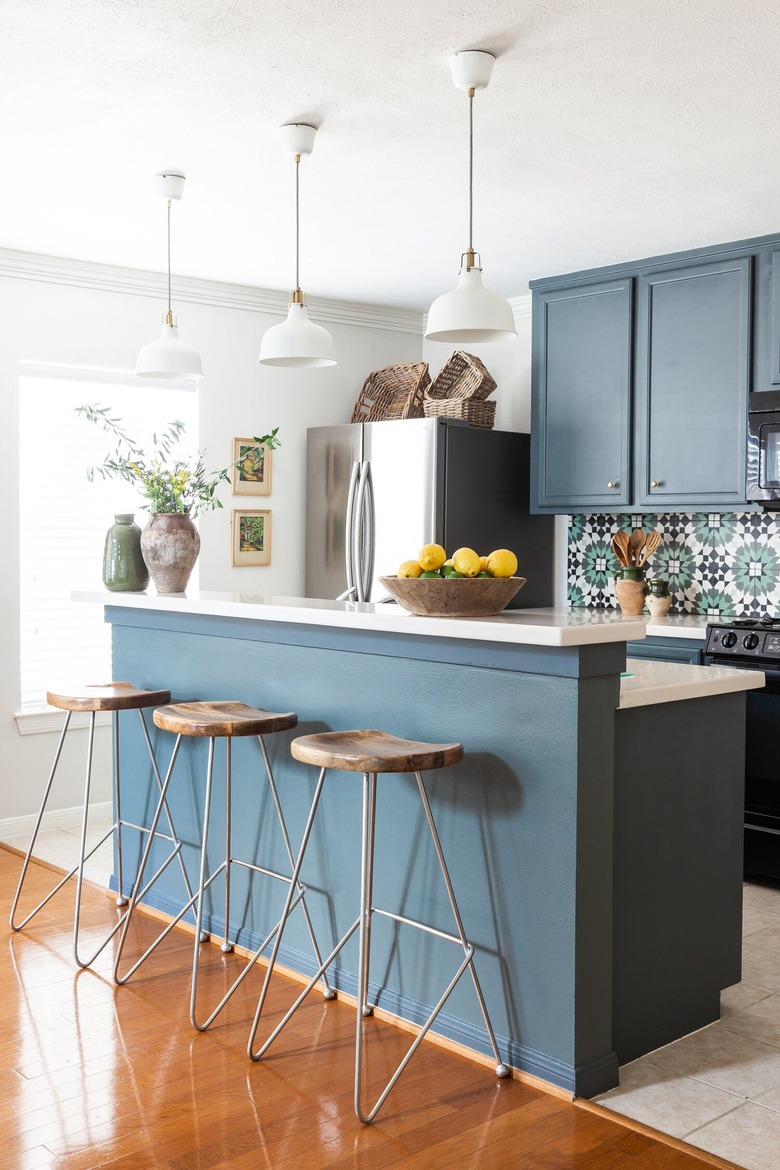 blue and white two-tier kitchen island with matching backsplash