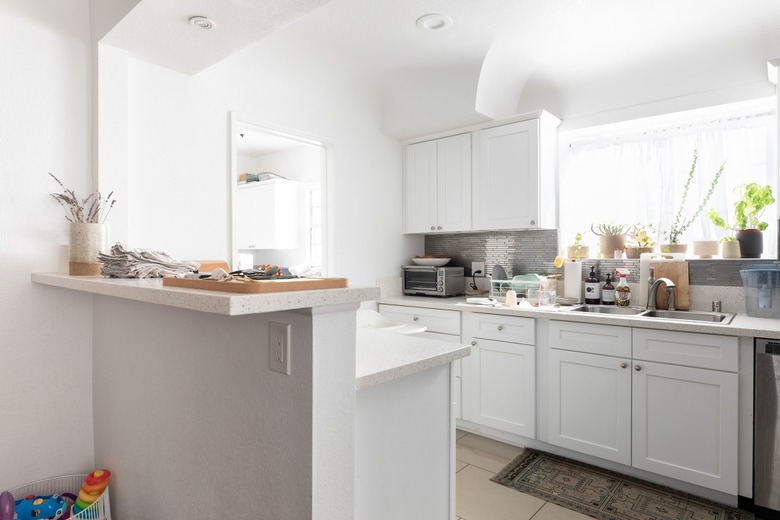 two-tier kitchen peninsula in white kitchen