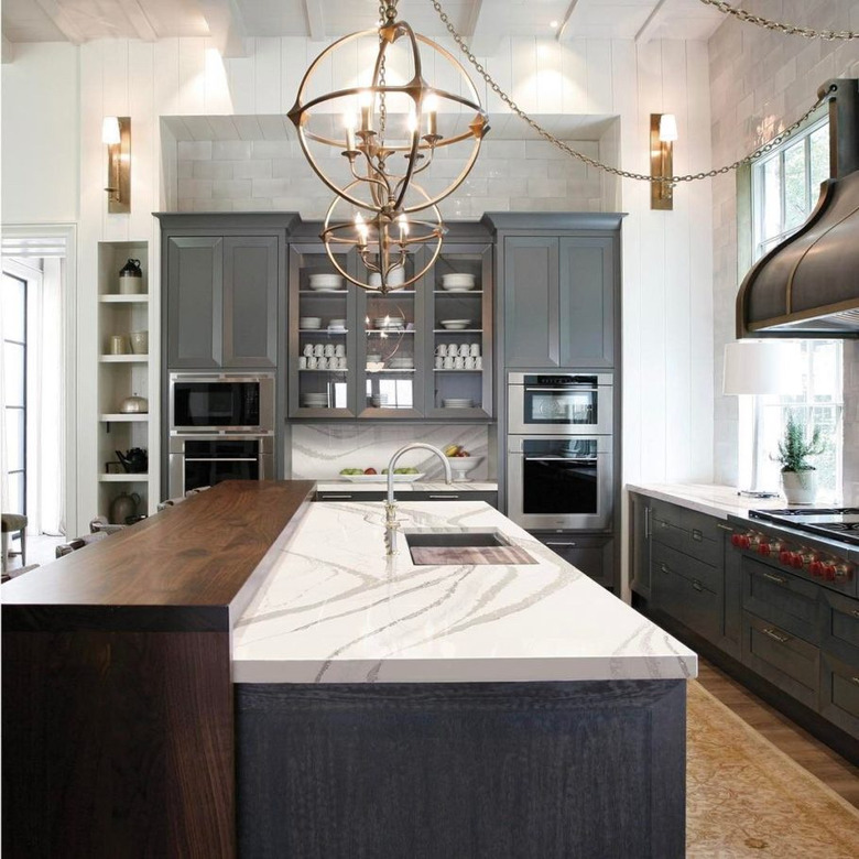 two tier kitchen island with wood and quartz countertop