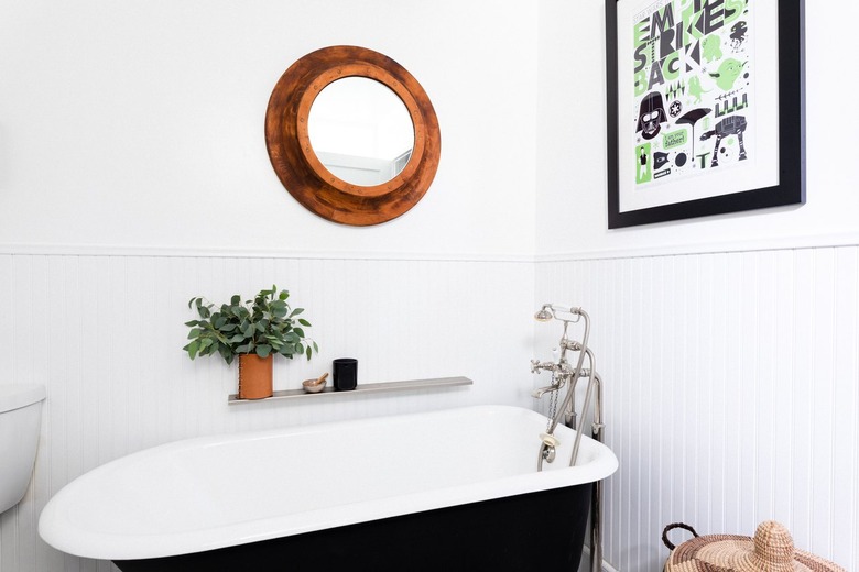 bathroom with chair rail above beadboard paneling