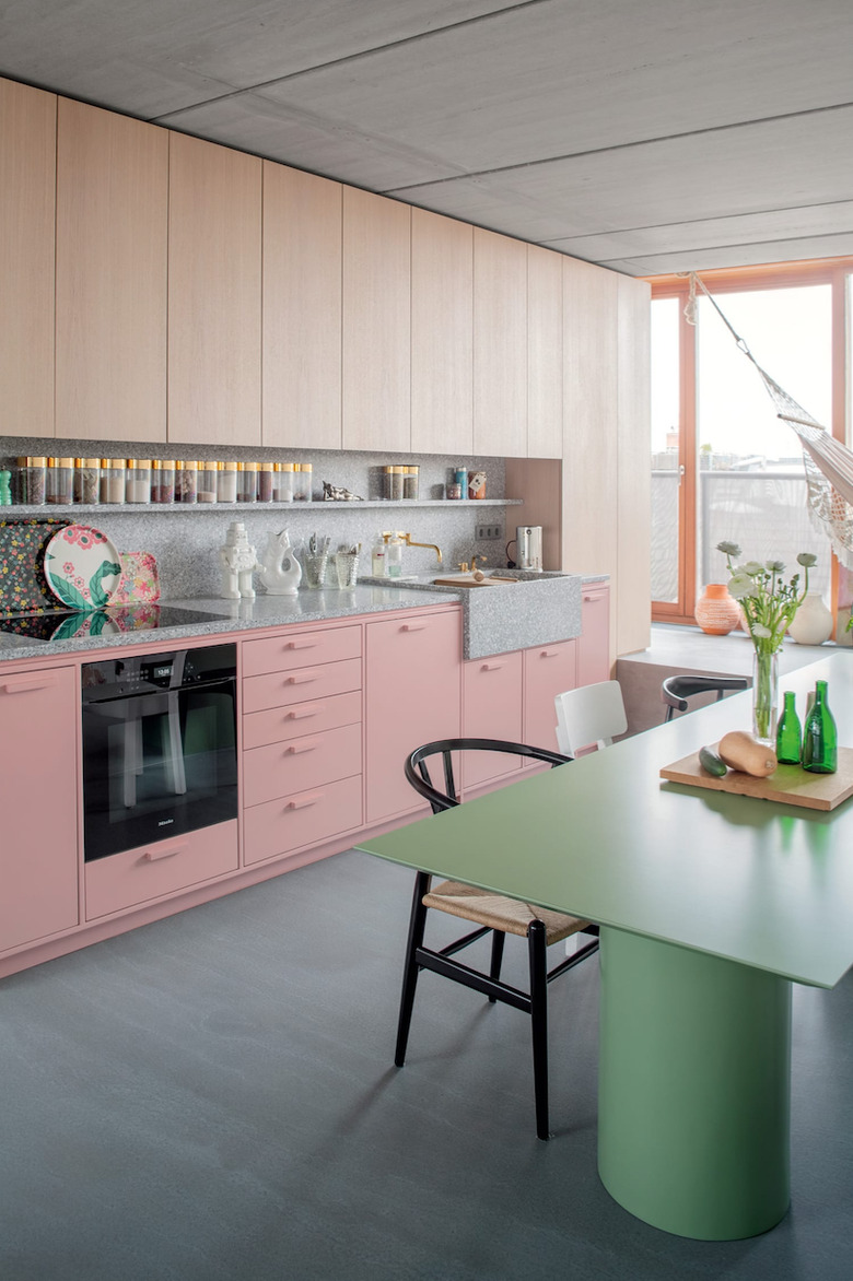 two-tone kitchen cabinets with pink and light wood finish