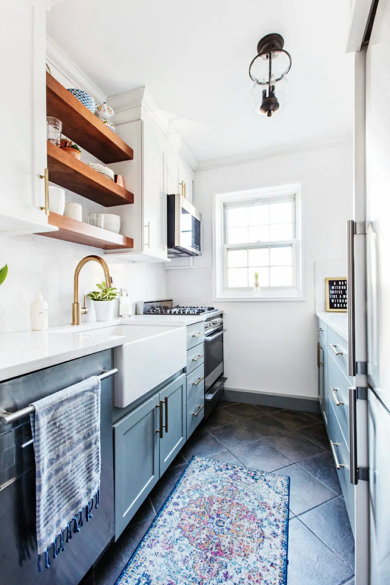 two-tone kitchen cabinets with white and green cabinets in galley kitchen