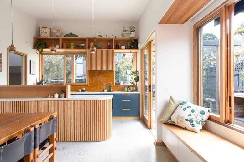 two-tone kitchen color idea with natural wood and blue cabinetry