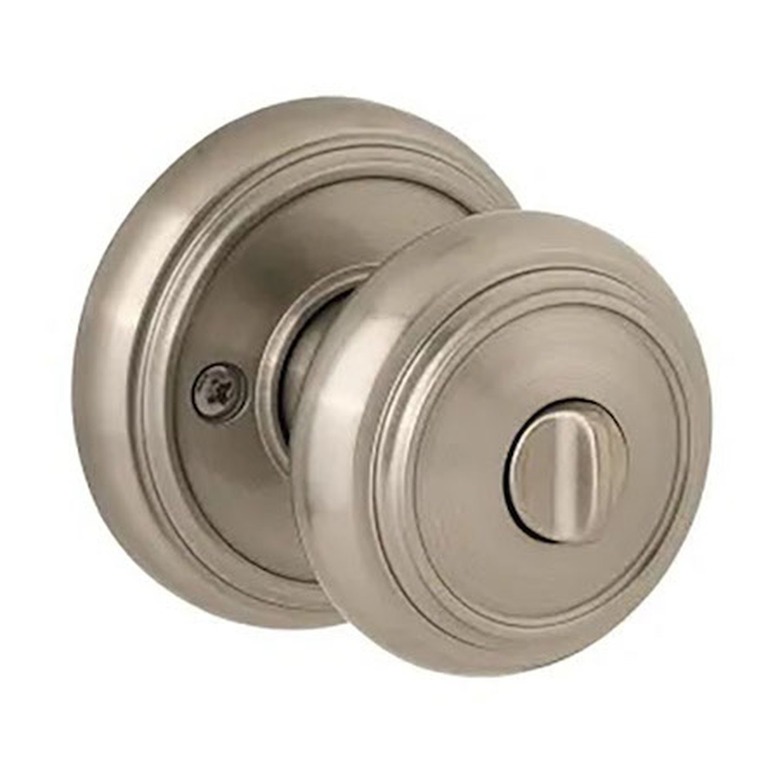 A satin nickel turn-button bathroom lock