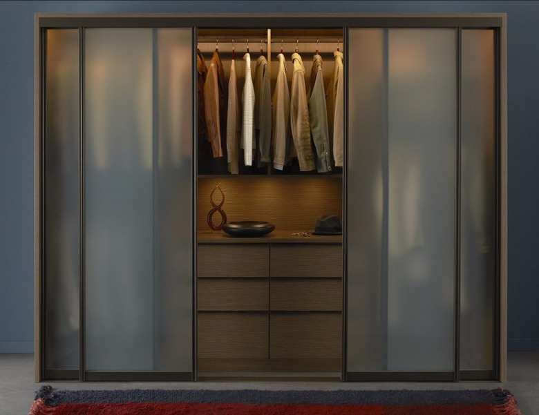 A dark frosted glass closet door