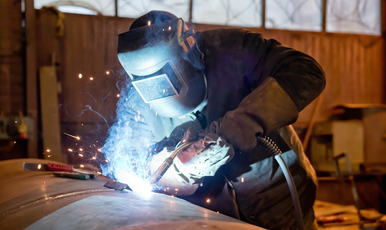 Semi-automatic welding with sparks and smoke