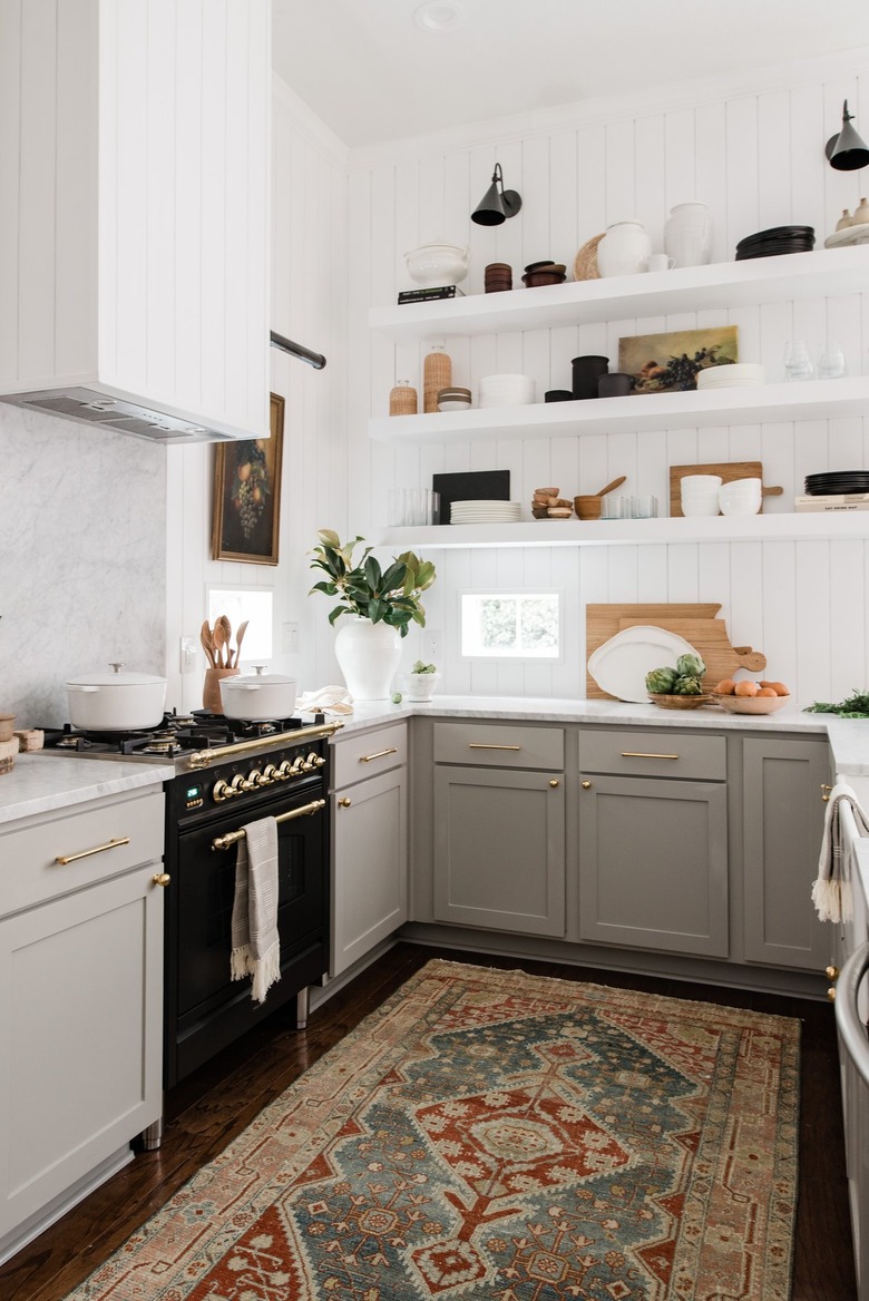 white and gray vintage u-shaped kitchen with shiplap