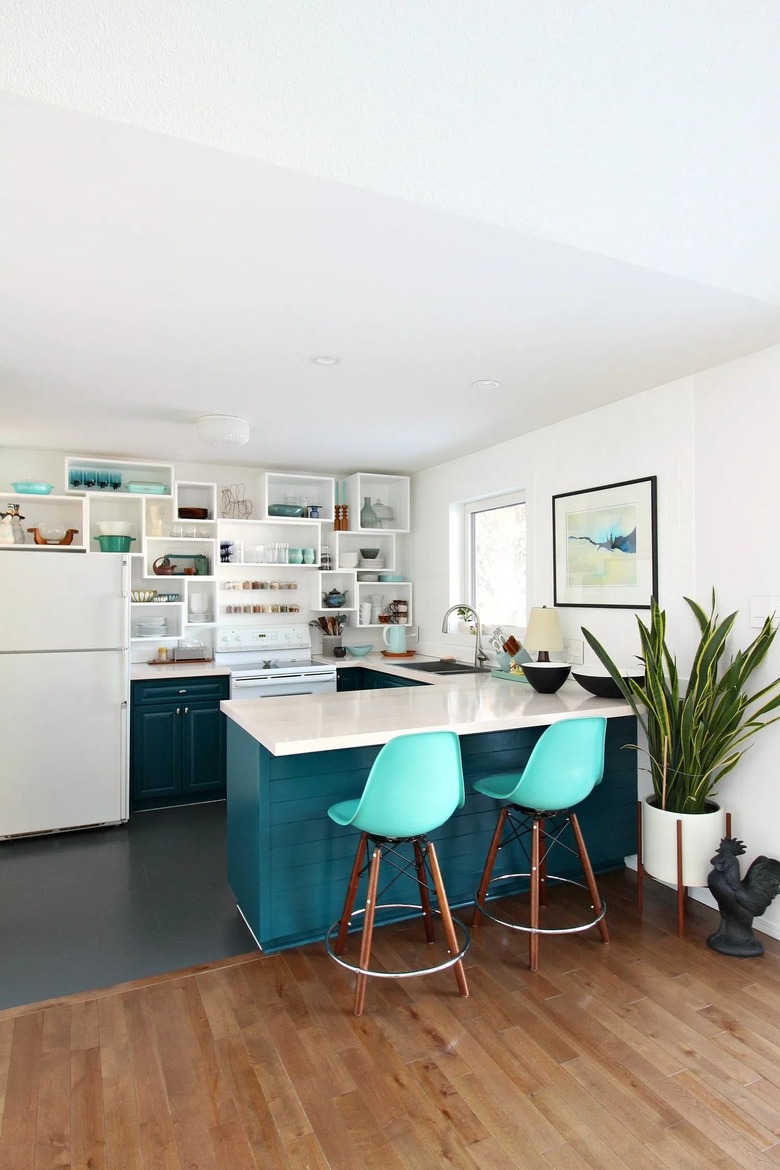 blue midcentury u-shaped kitchen with geometric shelving