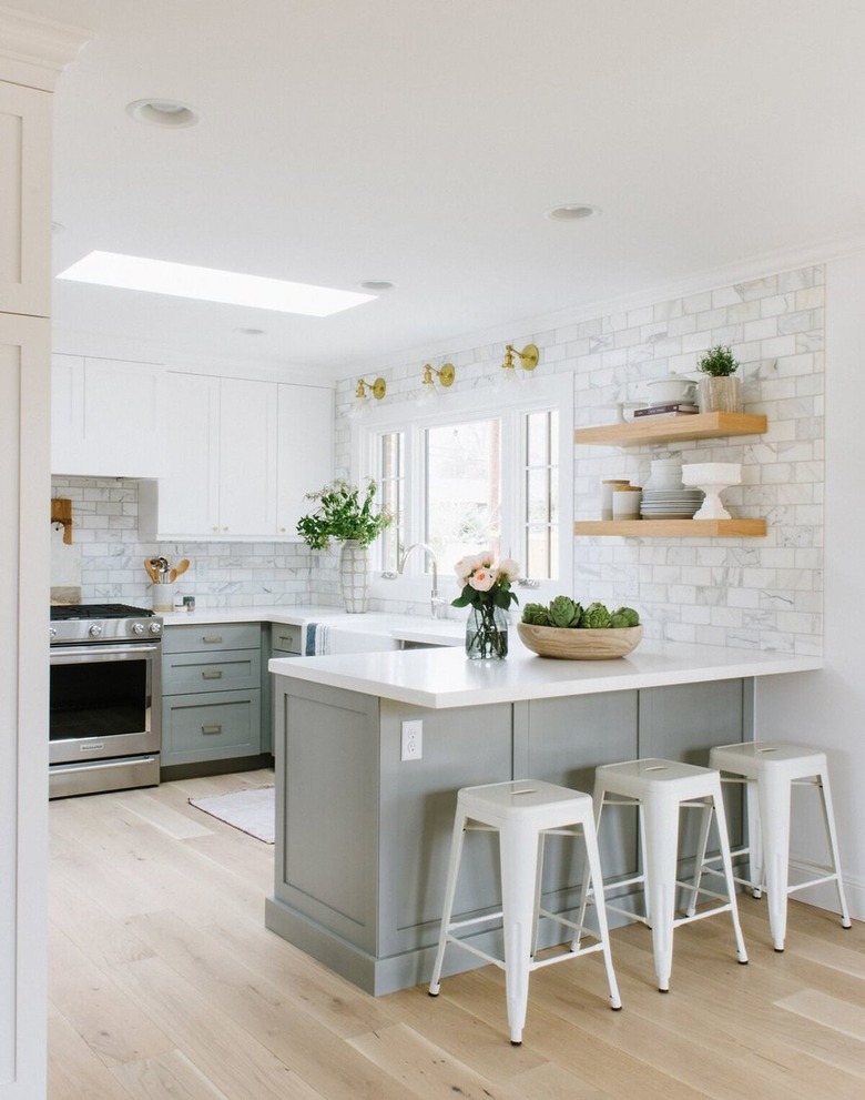 The stainless steel oven is a modern touch in an otherwise traditional kitchen.