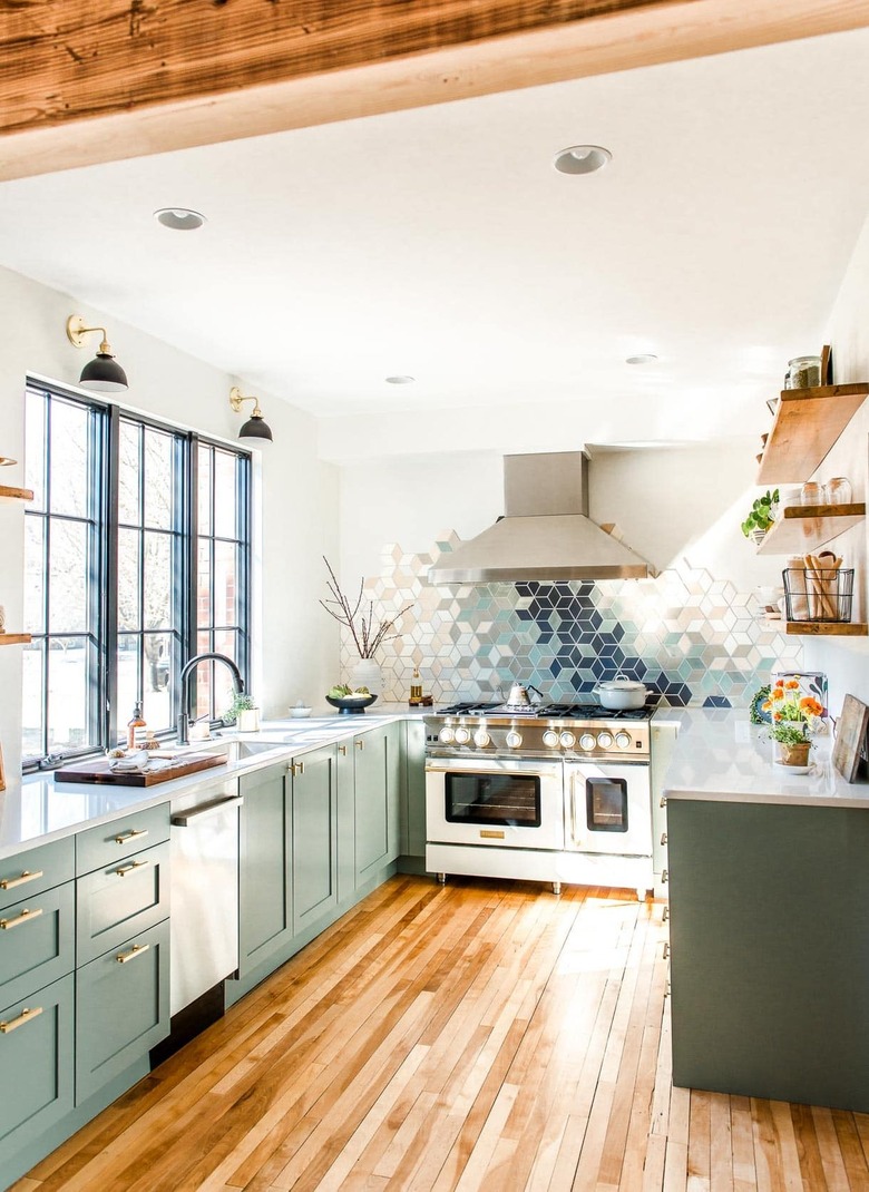 modern green u-shaped kitchen with geometric backsplash