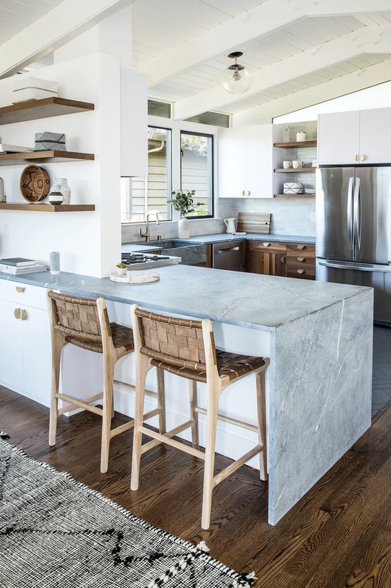 modern u-shaped kitchen with waterfall peninsula