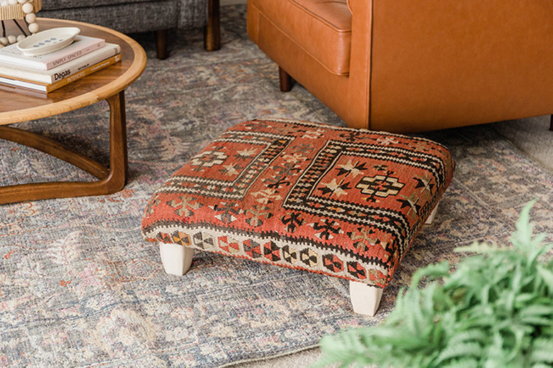 Learn how to make your own ottoman using a vintage rug.