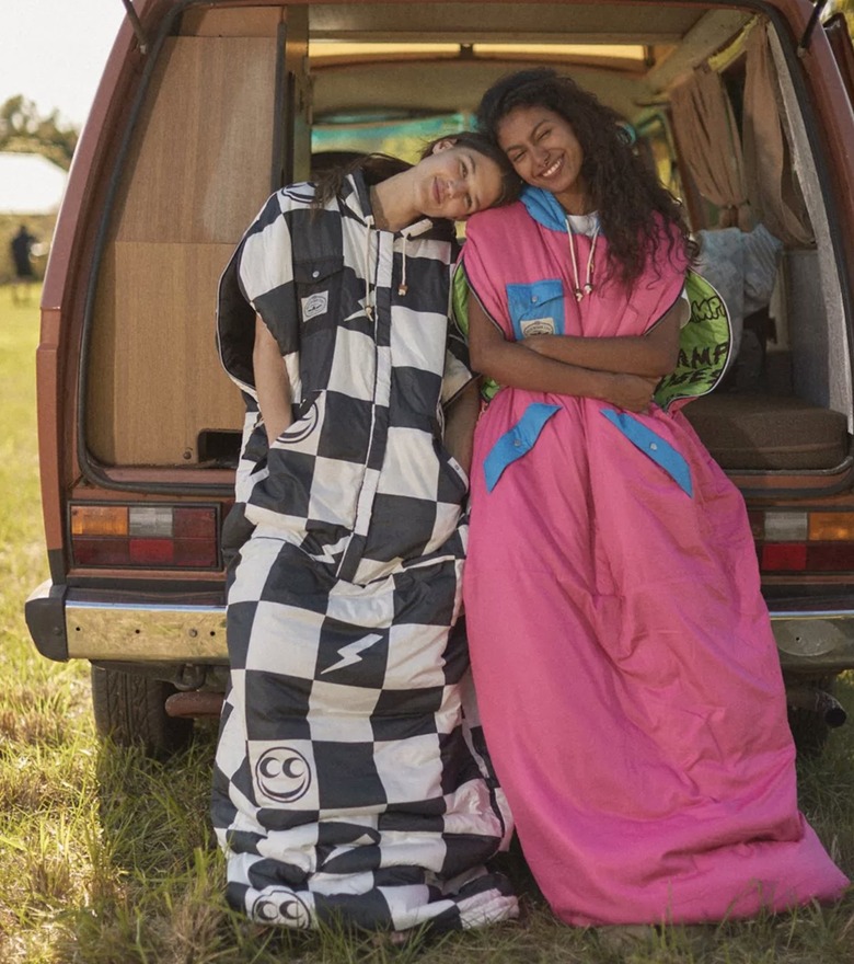 Image of two campers wearing Poler reversible nap sacks from Urban Outfitters