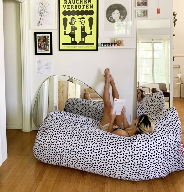 Image of young woman laying on an inflatable chair