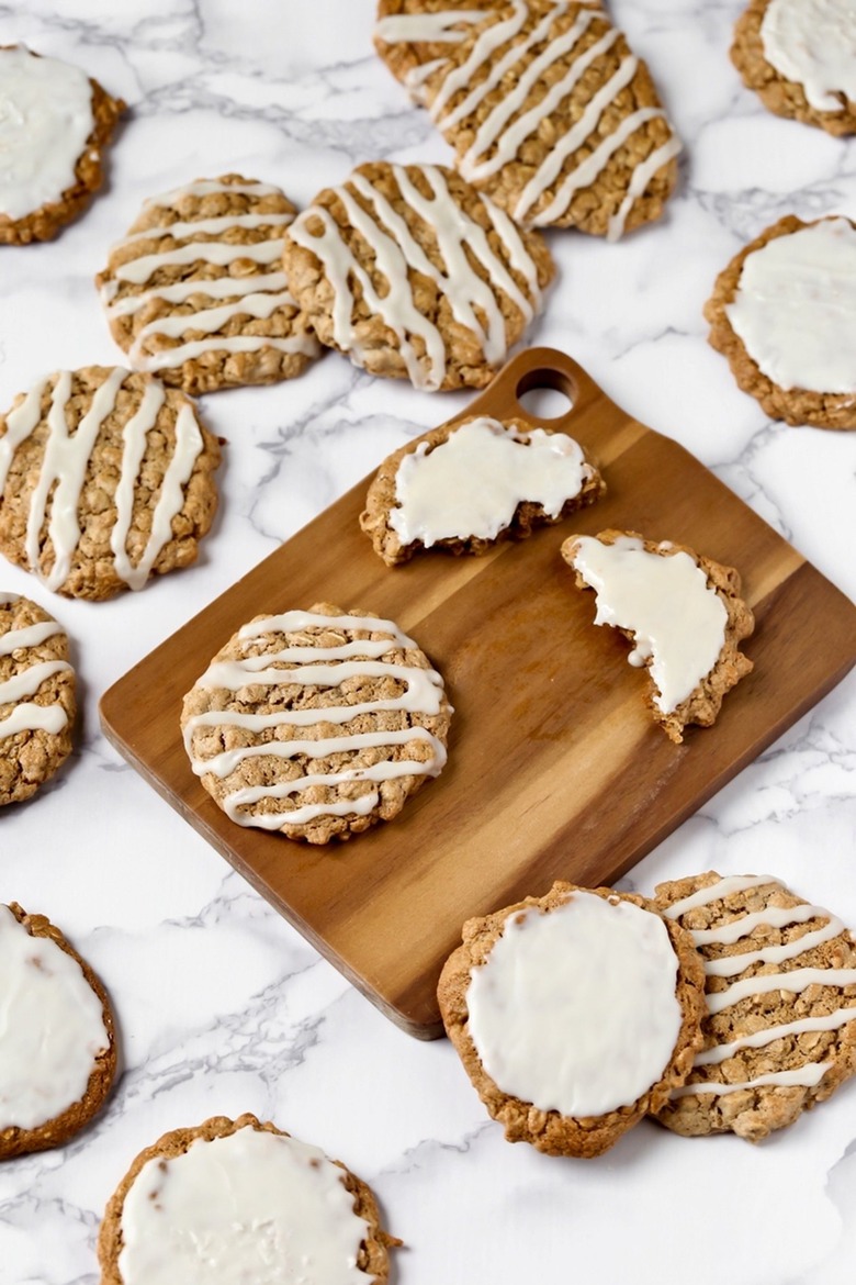 Oatmeal cookies with icing on a counter