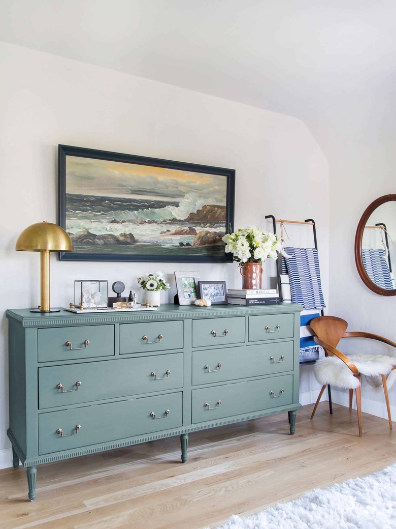 ocean oil painting in vintage bedroom