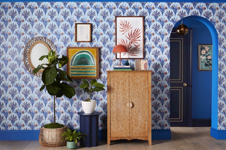 room with blue patterned wallpaper