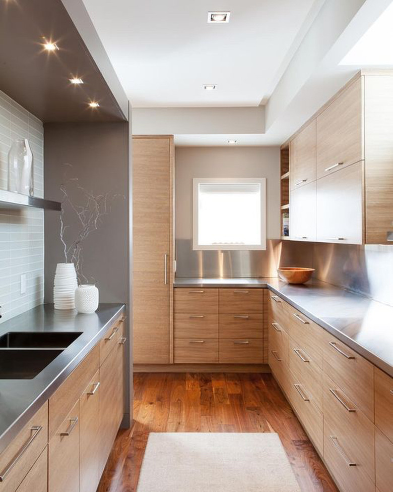 light wood kitchen with stainless steel countertops