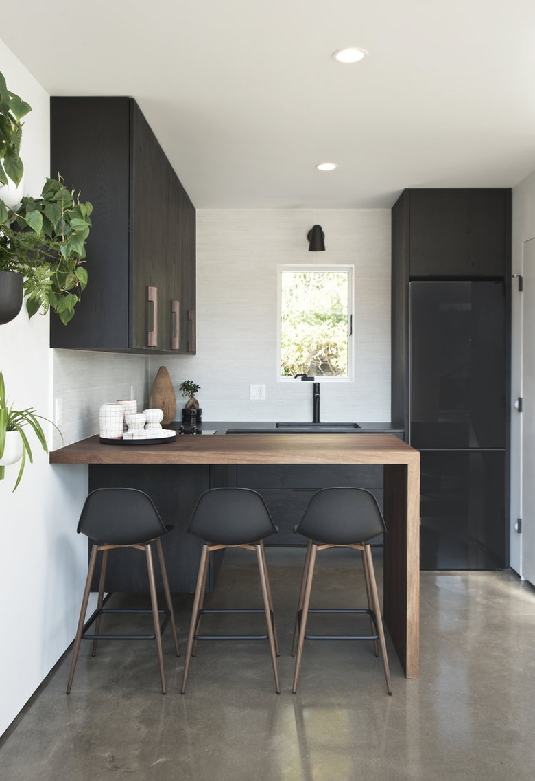 Wood Waterfall Countertop in Kitchen by Dichotomy Interiors