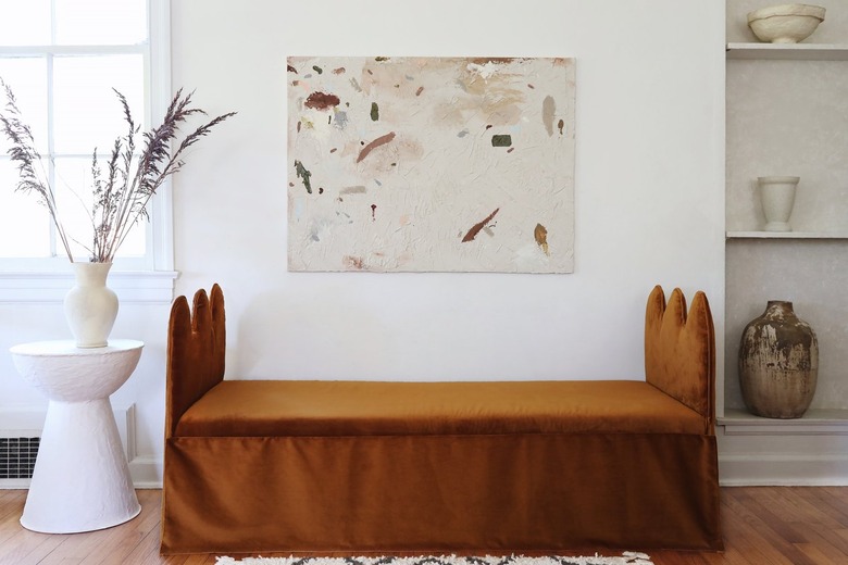 DIY wavy bench daybed with copper velvet fabric with abstract artwork hung above