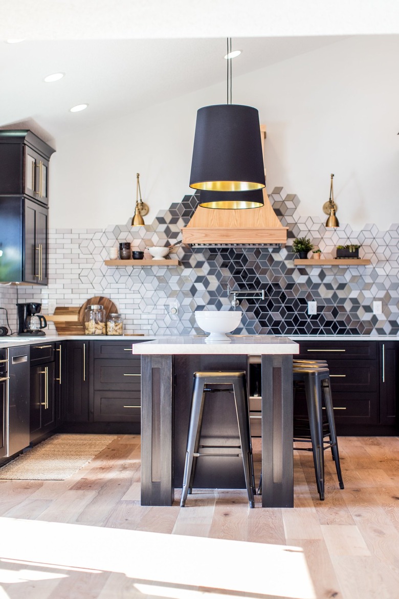 mosaic kitchen backsplash idea with black cabinets and island