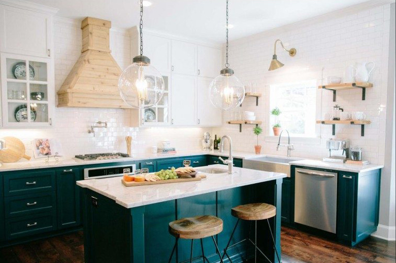 Craftsman kitchen with green cabinets and white subway tile walls