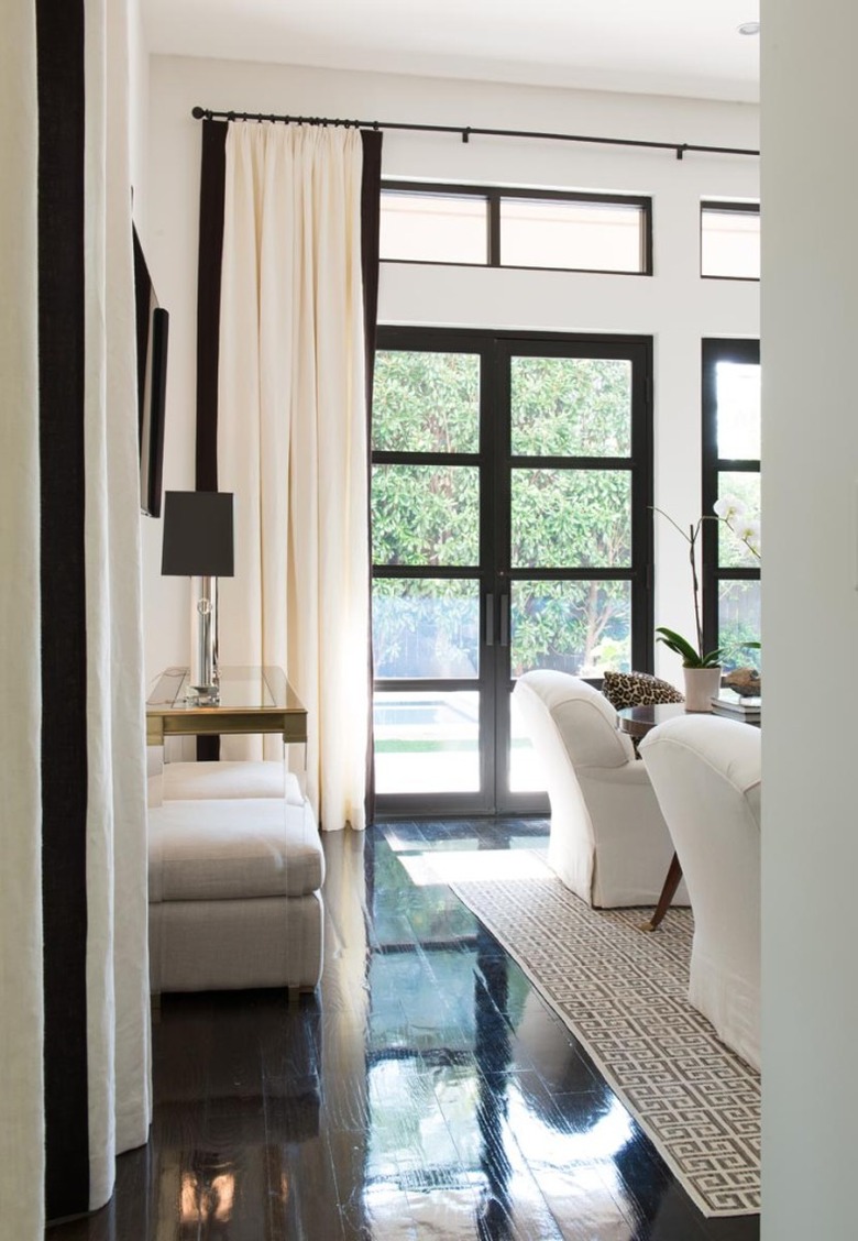 white and black living room with high gloss wood flooring