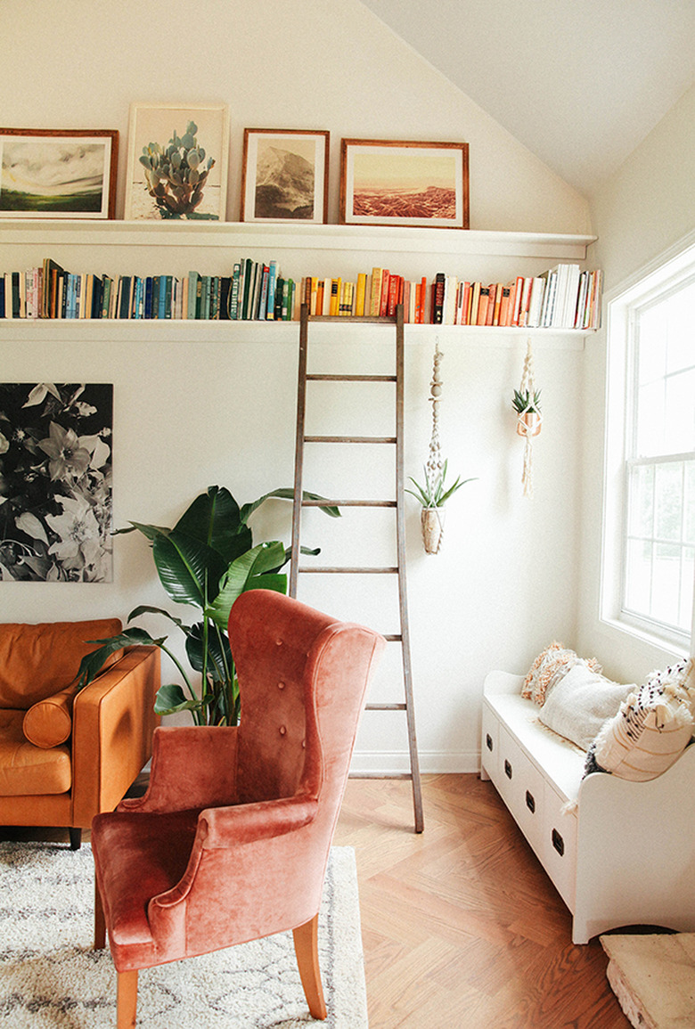 small living room with open shelving close to the ceiling