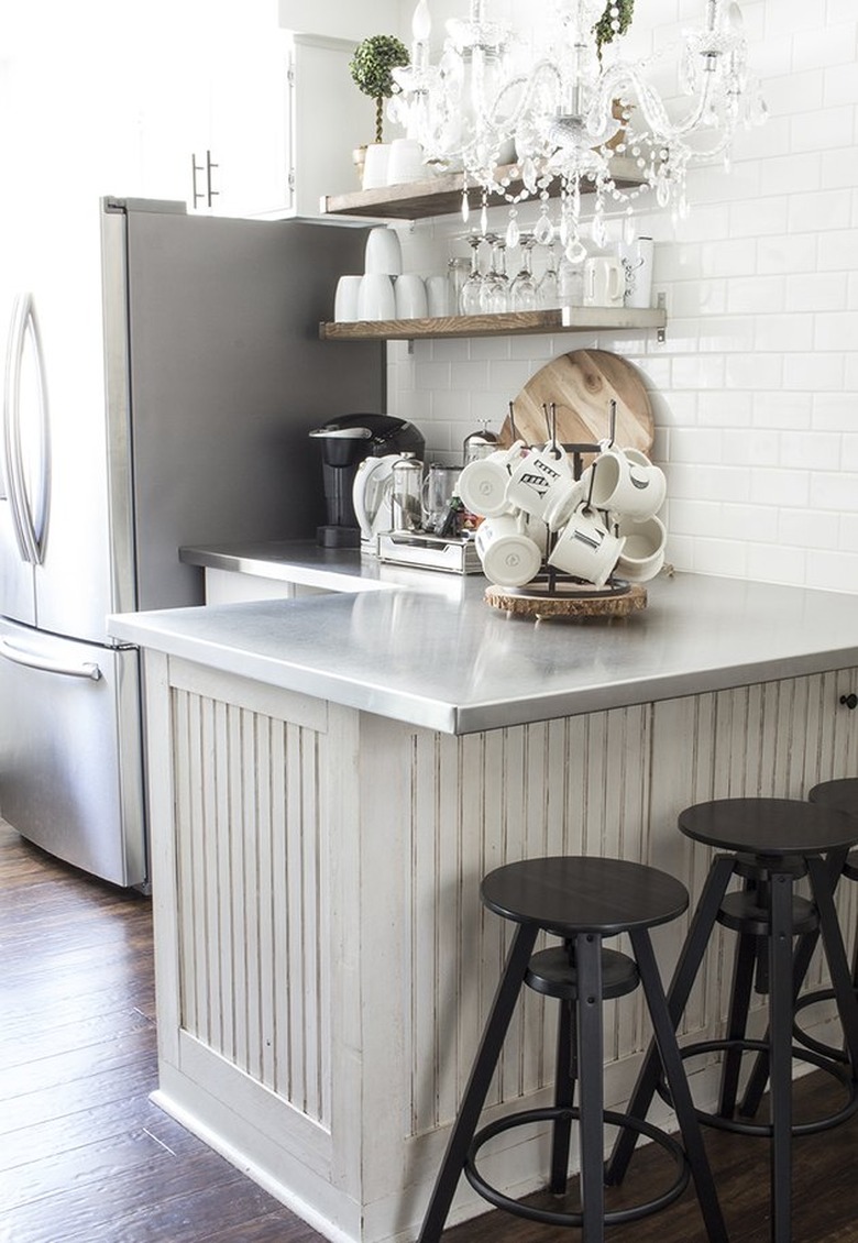 white kitchen with. stainless steel countertops