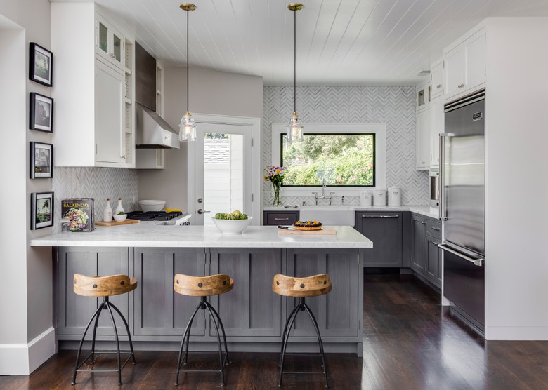 modern white kitchen with gray distressed cabinets