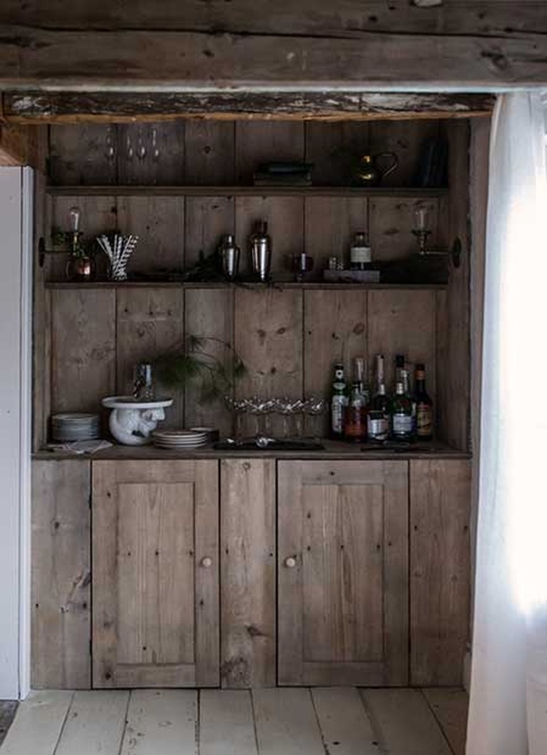 moody kitchen with distressed shelving unit