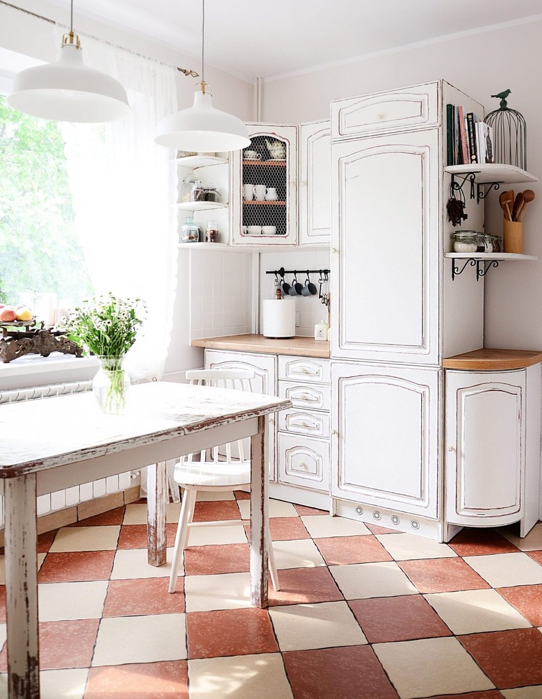 french country kitchen with checkered floor tiles