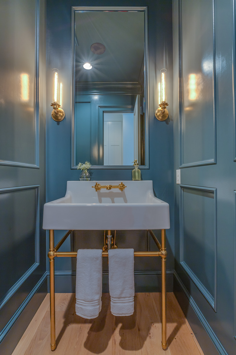 Powder room with a unique pedastal sink