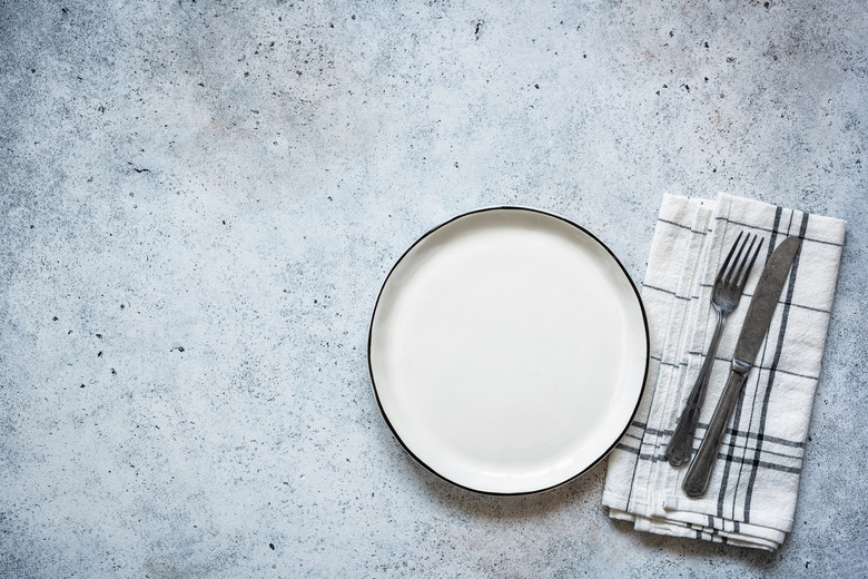 Table setting empty plate and cutlery