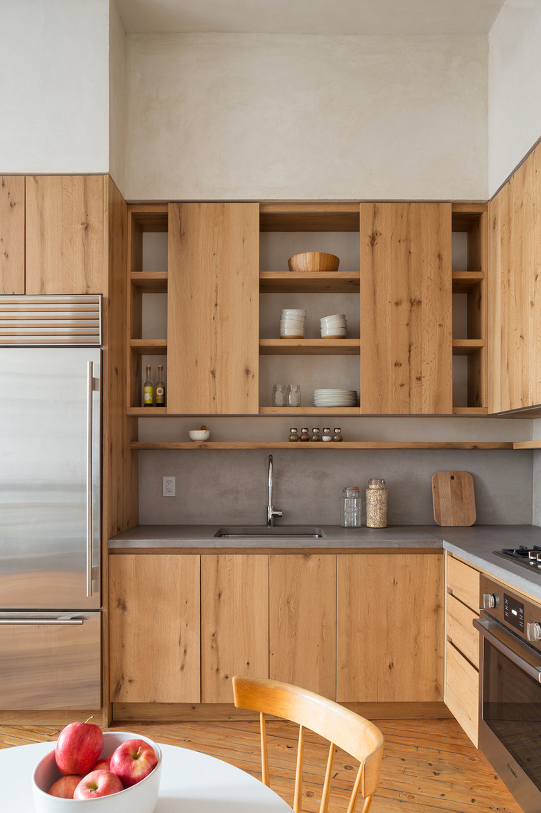 Countertops with Oak Cabinets in modern rustic oak kitchen with concrete countertops