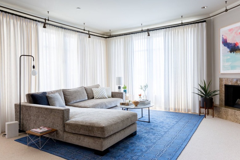 gray sectional sofa with royal blue area rug