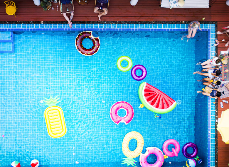 Aerial view of people enjoying the pool with inflatable tubes